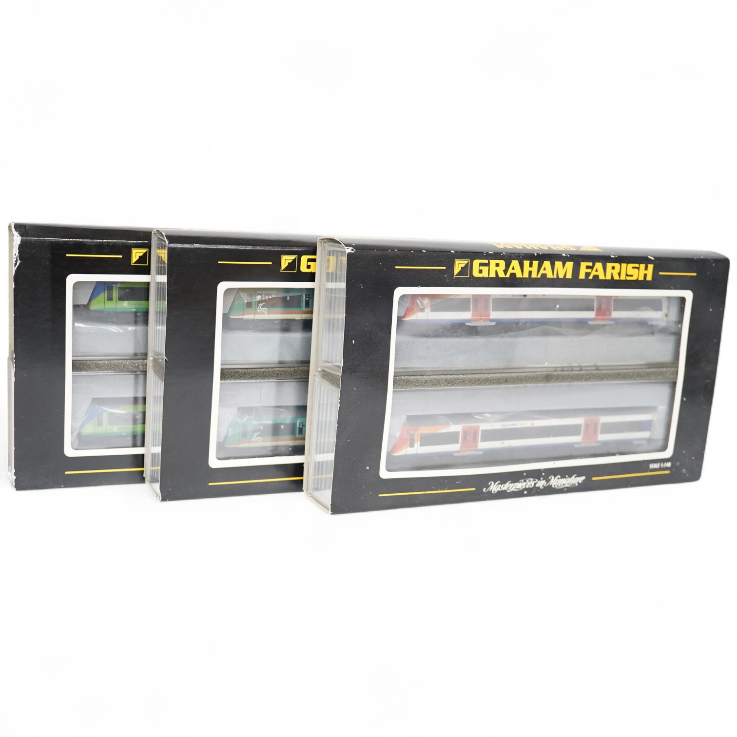 Three boxed Graham Farish N gauge railway DMU train packs; a South West Trains 170/4 2-car DMU (371-427), a Midland Mainline 170/1 Turbostar 2-car DMU (371-425), and a Central Trains Turbostar 170/5 2-car DMU (371-426).